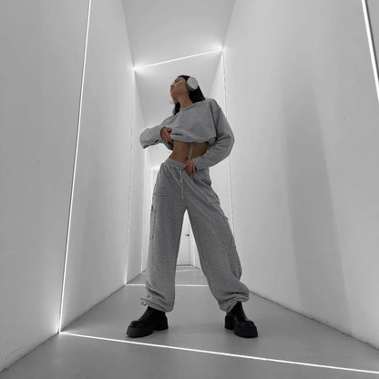 Damen Cropped Sweatshirt mit Kordelzug und weiten Ärmeln Grau