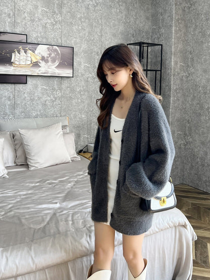 Damen Strickjacke Flauschig mit Taschen und Breitem Revers Norvielle