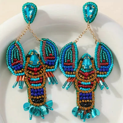 Türkise Lobster Statement-Ohrringe mit Perlen und Steinen
