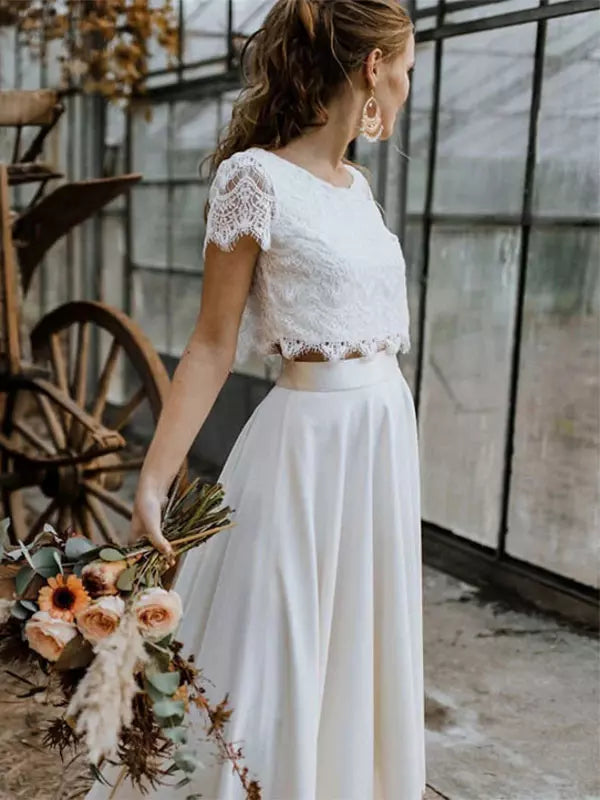 Brautkleid Spitzenoberteil Fließender Rock Weiße Romantik
