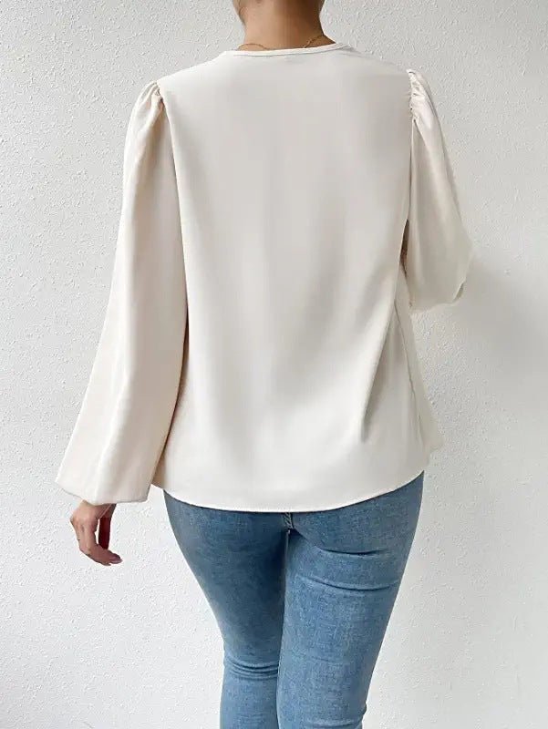 Elegante Damenbluse mit Drapé-Ausschnitt und langen Ärmeln